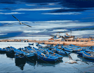Blue Fishing Boats On An Ocean Coast In Essaouira