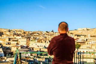 Male rooftop viewer of Fez Morocco North Africa
