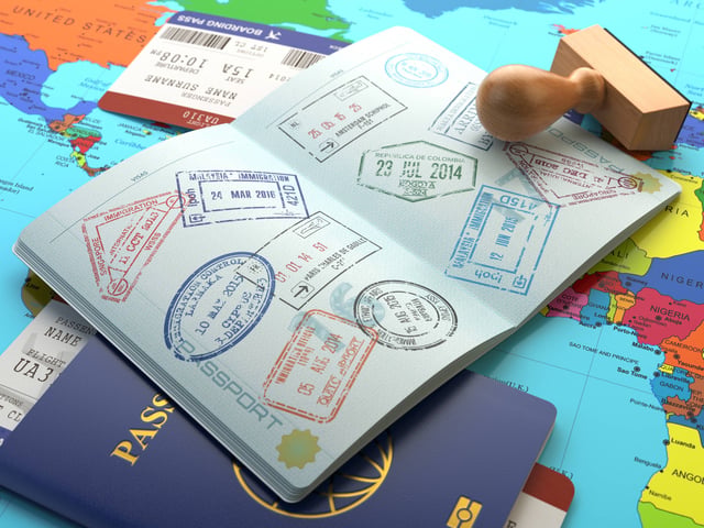 Passport with multiple travel stamps